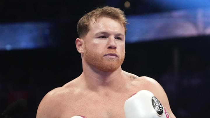 Canelo Alvarez (pink trunks) and Dimitry Bivol (black trunks) box during their light heavyweight championship bout at T-Mobile Arena. 