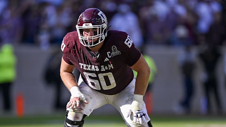 Dec 20, 2025; College Station, TX, USA; Texas A&M Aggies offensive lineman Trey Zuhn III (60) lines up during the game between the Aggies and the Hurricanes at Kyle Field. Mandatory Credit: Jerome Miron-Imagn Images