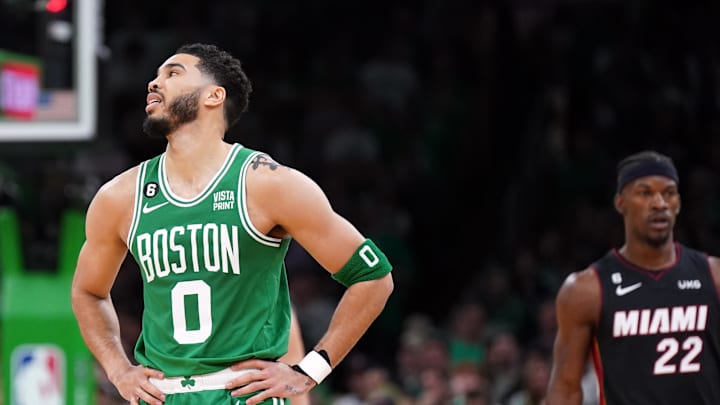 Boston Celtics forward Jayson Tatum reacts against the Miami Heat with Jimmy Butler in the background during game seven of the 2023 Eastern Conference Finals. Boston Celtics forward Jayson Tatum reacts against the Miami Heat with Jimmy Butler in the background during game seven of the 2023 Eastern Conference Finals.