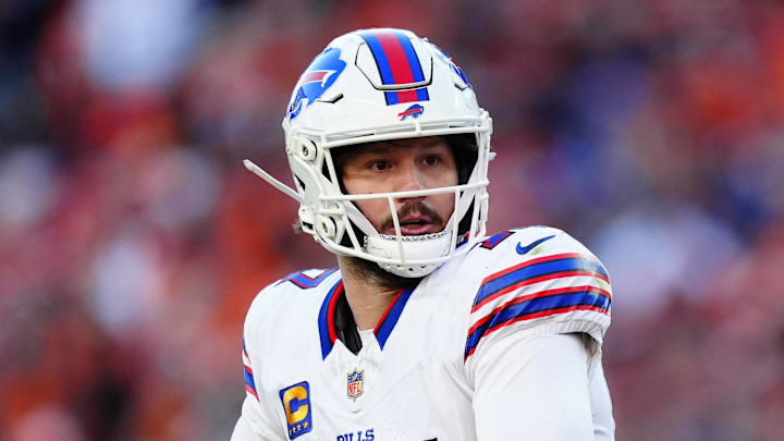 Jan 17, 2026; Denver, CO, USA; Buffalo Bills quarterback Josh Allen (17) rolls out during the second quarter of an AFC Divisional Round playoff game against the Denver Broncos at Empower Field at Mile High. Mandatory Credit: Ron Chenoy-Imagn Images