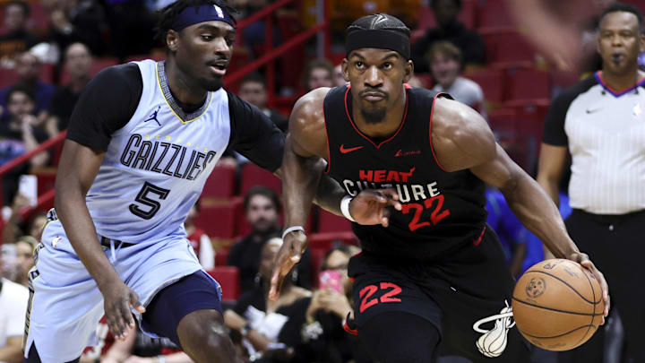Jan 24, 2024; Miami, Florida, USA; Miami Heat forward Jimmy Butler (22) drives to the basket against Memphis Grizzlies guard Vince Williams Jr. (5) during the first quarter at Kaseya Center. Mandatory Credit: Sam Navarro-Imagn Images
