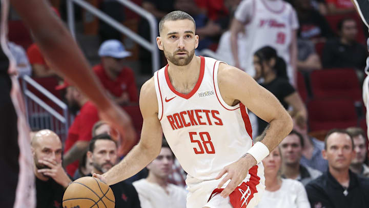 Houston Rockets guard Jack McVeigh dribbles the ball during the second half against the San Antonio Spurs at Toyota Center.