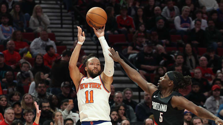 Jan 11, 2026; Portland, Oregon, USA;  New York Knicks guard Jalen Brunson (11) shoots the ball over Portland Trail Blazers guard Jrue Holiday (5) during the second half at Moda Center. Mandatory Credit: Jaime Valdez-Imagn Images