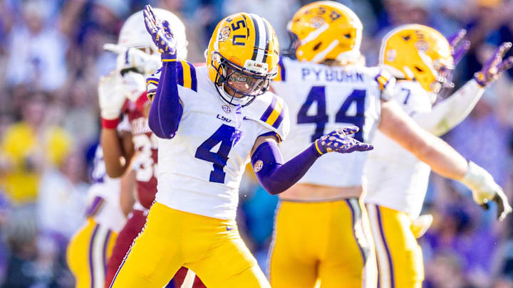 Nov 15, 2025; Baton Rouge, Louisiana, USA;  LSU Tigers cornerback Mansoor Delane (4) reacts to a stop on fourth down against the Arkansas Razorbacks during the second half at Tiger Stadium. Mandatory Credit: Stephen Lew-Imagn Images