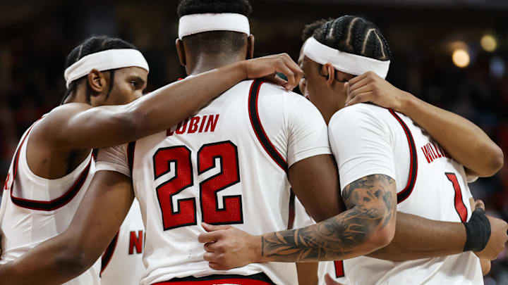 Jan 27, 2026; Raleigh, North Carolina, USA; NC State Wolfpack huddles during the first half of the game against the Syracuse Orange at Lenovo Center. Mandatory Credit: Jaylynn Nash-Imagn Images Jan 27, 2026; Raleigh, North Carolina, USA; NC State Wolfpack huddles during the first half of the game against the Syracuse Orange at Lenovo Center. Mandatory Credit: Jaylynn Nash-Imagn Images
