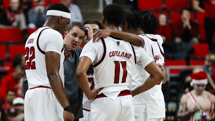 Dec 6, 2025; Raleigh, North Carolina, USA; NC State Wolfpack huddle with head coach Will Wade during the second half of the game against UNC Asheville Bulldogs at Lenovo Center. Mandatory Credit: Jaylynn Nash-Imagn Images Dec 6, 2025; Raleigh, North Carolina, USA; NC State Wolfpack huddle with head coach Will Wade during the second half of the game against UNC Asheville Bulldogs at Lenovo Center. Mandatory Credit: Jaylynn Nash-Imagn Images