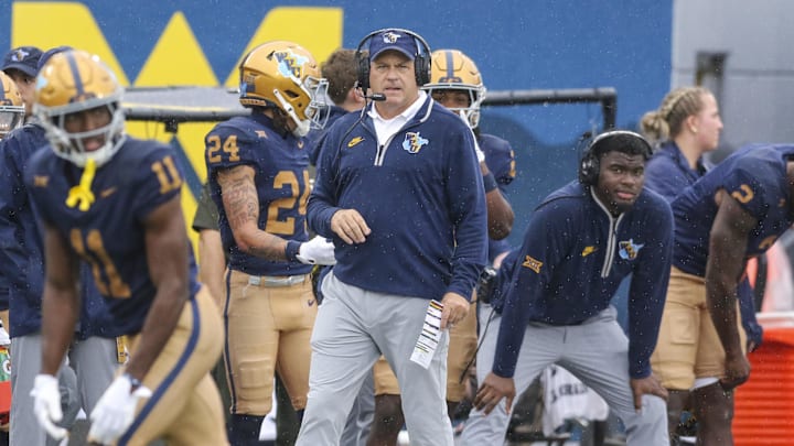 Sep 27, 2025; Morgantown, West Virginia, USA; West Virginia Mountaineers head coach Rich Rodriguez watches a play during the first quarter against the Utah Utes at Milan Puskar Stadium.