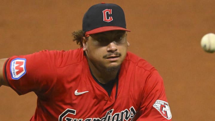 Sep 25, 2024; Cleveland, Ohio, USA; Cleveland Guardians first baseman Josh Naylor (22) retrieves the ball on an errant throw by second baseman Andres Gimenez (not pictured) in the seventh inning against the Cincinnati Reds at Progressive Field. Mandatory Credit: David Richard-Imagn Images
