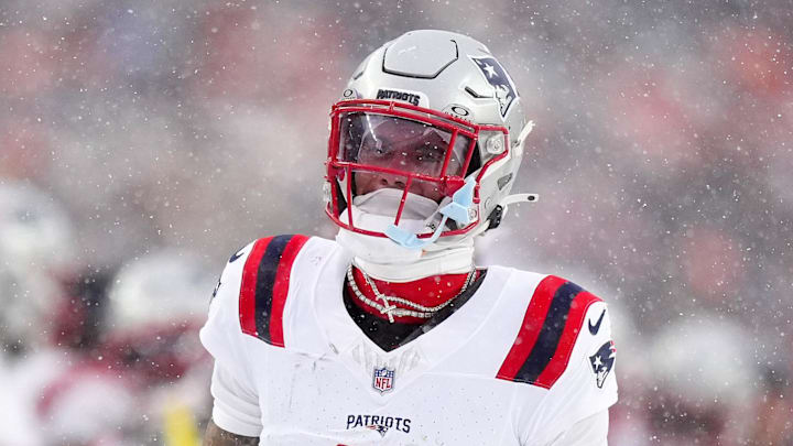 Jan 25, 2026; Denver, CO, USA; New England Patriots cornerback Christian Gonzalez (0) reacts after an interception against the Denver Broncos  during the second half in the 2026 AFC Championship Game at Empower Field at Mile High. Mandatory Credit: Ron Chenoy-Imagn Images