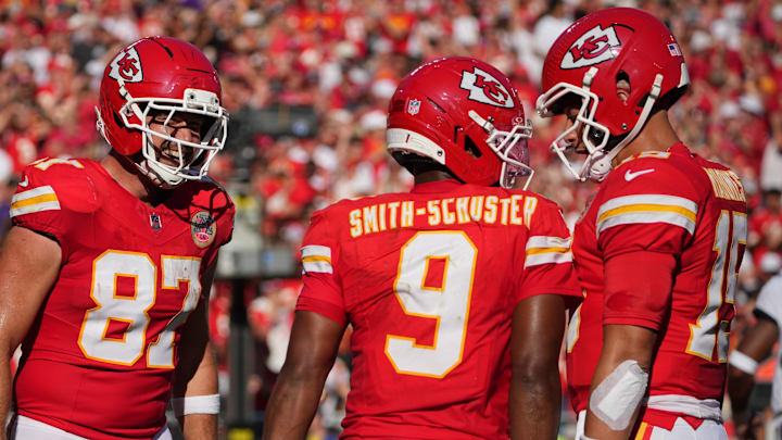 Sep 28, 2025; Kansas City, Missouri, USA;  Kansas City Chiefs wide receiver JuJu Smith-Schuster (9) celebrates with Kansas City Chiefs tight end Travis Kelce (87) and Kansas City Chiefs quarterback Patrick Mahomes (15) after scoring a touchdown during the second quarter against the Baltimore Ravens at GEHA Field at Arrowhead Stadium. Mandatory Credit: Denny Medley-Imagn Images