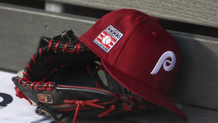 Jul 25, 2025; Bronx, New York, USA; A detailed view of a Hall of Fame patch on a Philadelphia Phillies hat resting in the dugout during the second inning against the New York Yankees at Yankee Stadium. Jul 25, 2025; Bronx, New York, USA; A detailed view of a Hall of Fame patch on a Philadelphia Phillies hat resting in the dugout during the second inning against the New York Yankees at Yankee Stadium.