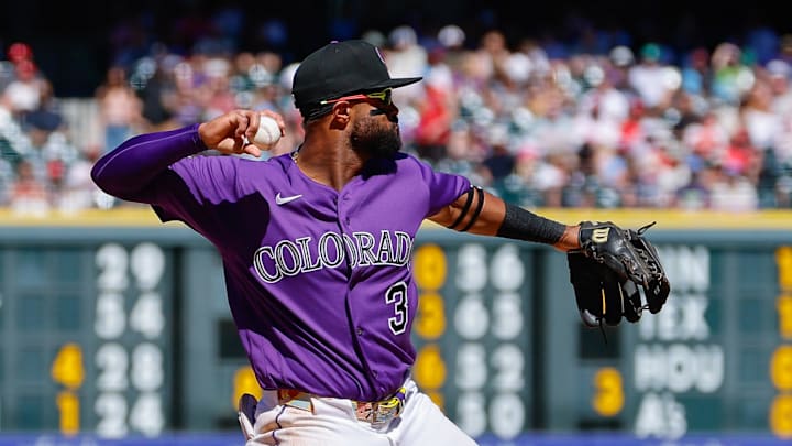 Colorado Rockies third baseman Willi Castro (3) throws to first for an out in the seventh inning against the Philadelphia Phillies at Coors Field.