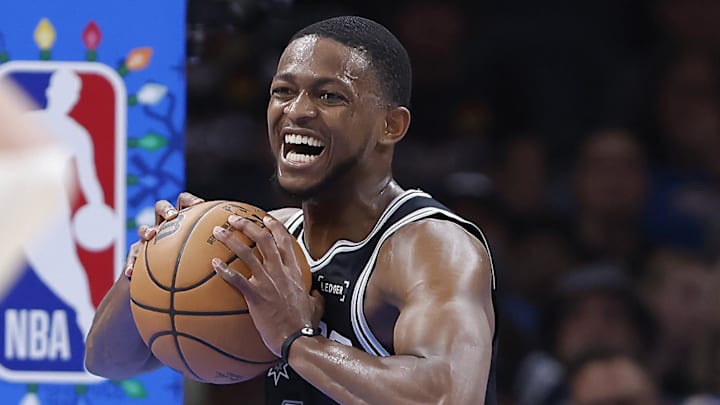 Dec 25, 2025; Oklahoma City, Oklahoma, USA; San Antonio Spurs guard De'Aaron Fox (4) celebrates after a play against the Oklahoma City Thunder during the second half at Paycom Center. Mandatory Credit: Alonzo Adams-Imagn Images