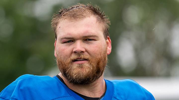 Detroit Lions center Cade Mays (64) looks on during training camp Detroit Lions center Cade Mays (64) looks on during training camp