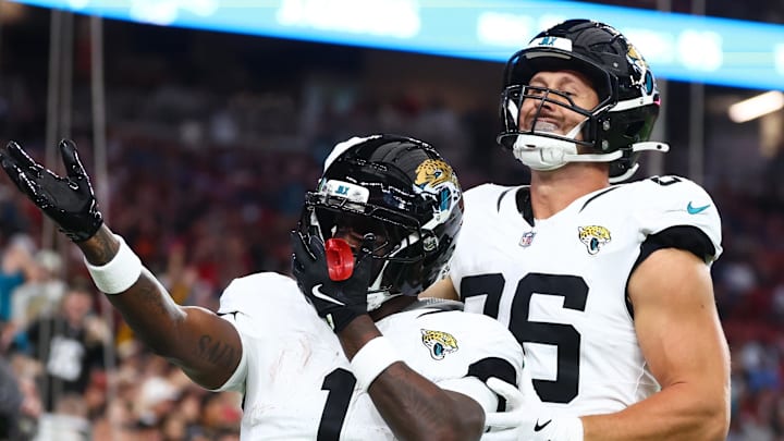 Nov 23, 2025; Glendale, Arizona, USA; Jacksonville Jaguars running back Travis Etienne Jr. (1) celebrates after scoring a touchdown during the first quarter against the Arizona Cardinals at State Farm Stadium. Mandatory Credit: Mark J. Rebilas-Imagn Images