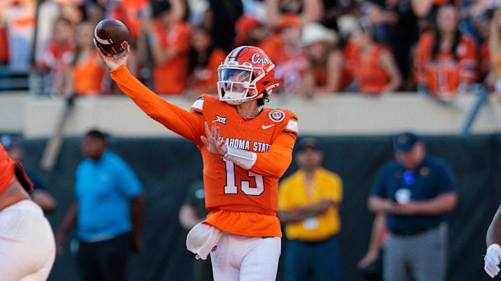 Oct 5, 2024; Stillwater, Oklahoma, USA; Oklahoma State Cowboys quarterback Garret Rangel (13) throws a pass against the West Virginia Mountaineers during the fourth quarter at Boone Pickens Stadium. Mandatory Credit: William Purnell-Imagn Images Oct 5, 2024; Stillwater, Oklahoma, USA; Oklahoma State Cowboys quarterback Garret Rangel (13) throws a pass against the West Virginia Mountaineers during the fourth quarter at Boone Pickens Stadium. Mandatory Credit: William Purnell-Imagn Images