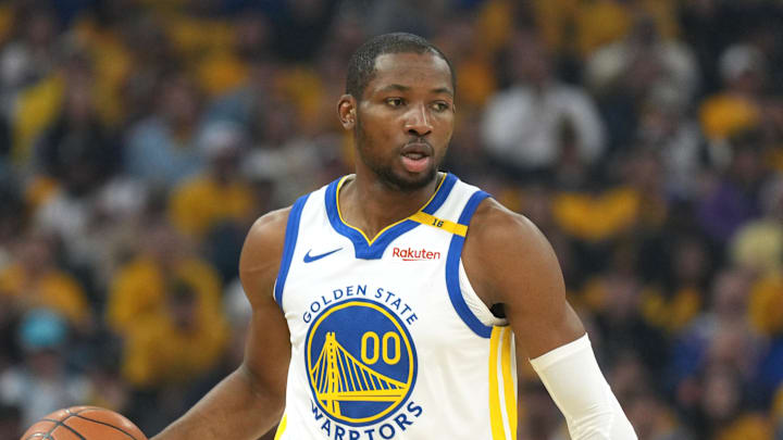 Apr 26, 2025; San Francisco, California, USA; Golden State Warriors forward Jonathan Kuminga (00) handles the ball against the Houston Rockets during the first quarter of game three of first round for the 2024 NBA Playoffs at Chase Center. Mandatory Credit: Darren Yamashita-Imagn Images