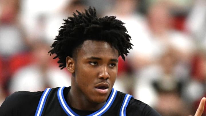 Mar 2, 2026; Raleigh, North Carolina, USA; Duke Blue Devils center Patrick Ngongba II (21) reacts after scoring against the NC State Wolfpack during the first half at Lenovo Center. Mandatory Credit: Zachary Taft-Imagn Images Mar 2, 2026; Raleigh, North Carolina, USA; Duke Blue Devils center Patrick Ngongba II (21) reacts after scoring against the NC State Wolfpack during the first half at Lenovo Center. Mandatory Credit: Zachary Taft-Imagn Images