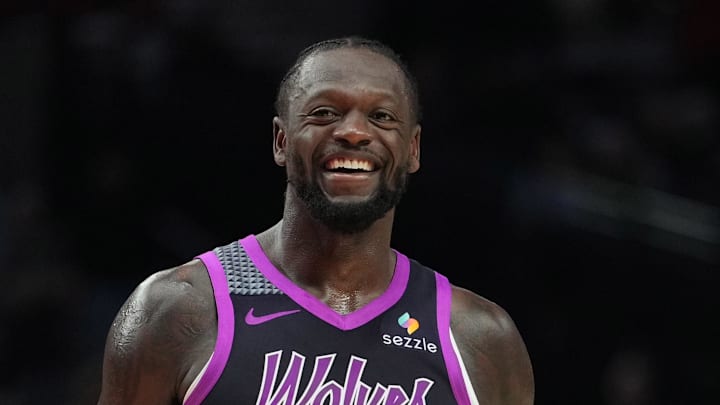 Feb 24, 2026; Portland, Oregon, USA; Minnesota Timberwolves forward Julius Randle (30) and Portland Trail Blazers guard Jrue Holiday (5) share a laugh during the second half at Moda Center. Mandatory Credit: Soobum Im-Imagn Images