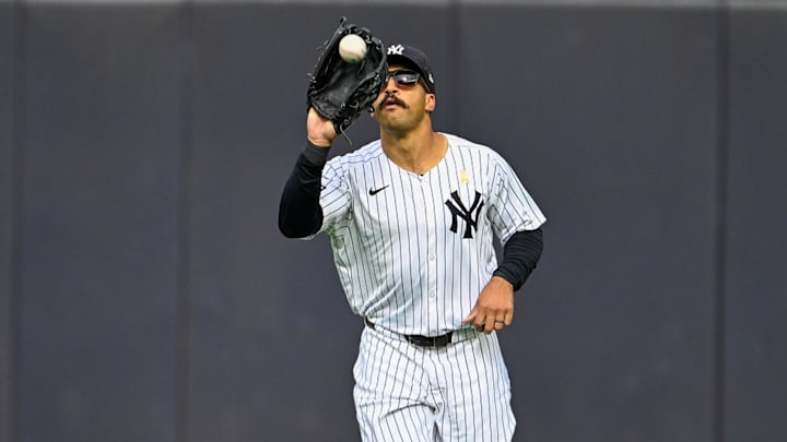 Sep 7, 2025; Bronx, New York, USA; New York Yankees center fielder Trent Grisham (12) catches a fly ball during the ninth inning against the Toronto Blue Jays at Yankee Stadium. Mandatory Credit: Mark Smith-Imagn Images