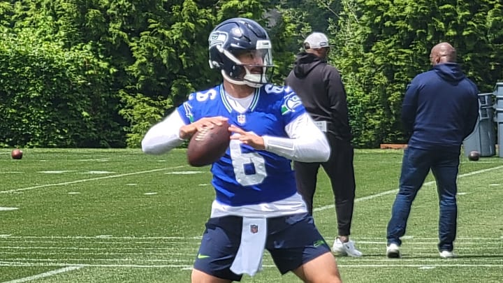 Seahawks quarterback Sam Howell prepares to throw during individual drills at the team's second open OTA practice.
