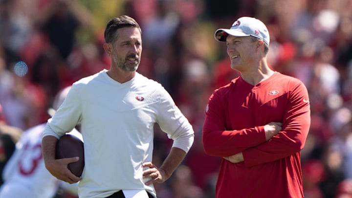 Jul 27, 2022; Santa Clara, CA, USA; San Francisco 49ers head coach Kyle Shanahan (left) and general manager John Lynch watches the players during Training Camp at the SAP Performance Facility near Levi Stadium. Mandatory Credit: Stan Szeto-Imagn Images