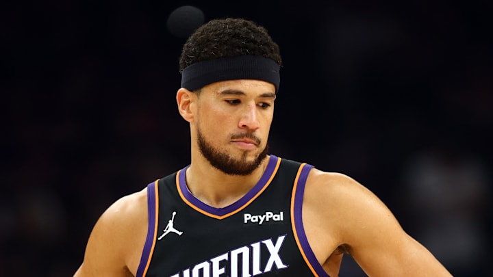 Apr 14, 2026; Phoenix, Arizona, USA; Phoenix Suns guard Devin Booker (1) against the Portland Trail Blazers during the play-in rounds of the 2026 NBA Playoffs at Mortgage Matchup Center. Mandatory Credit: Mark J. Rebilas-Imagn Images
Apr 14, 2026; Phoenix, Arizona, USA; Phoenix Suns guard Devin Booker (1) against the Portland Trail Blazers during the play-in rounds of the 2026 NBA Playoffs at Mortgage Matchup Center. Mandatory Credit: Mark J. Rebilas-Imagn Images