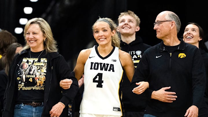 Iowa guard Kylie Feuerbach (4) walks onto the court for senior recognition Feb. 22, 2026 at Carver-Hawkeye Arena in Iowa City, Iowa.