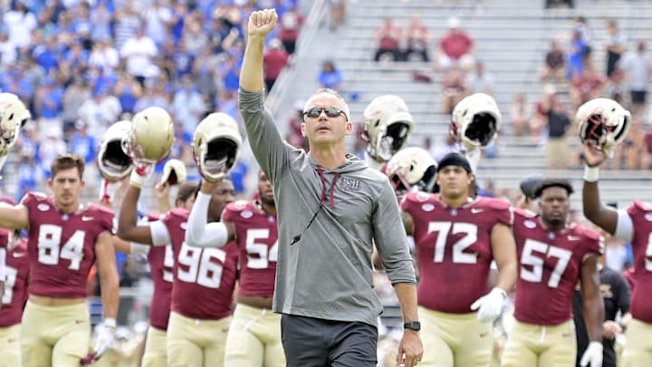 Sep 14, 2024; Tallahassee, Florida, USA; Florida State Seminoles head coach Mike Norvell leads his team before a game against the Memphis Tigers at Doak S. Campbell Stadium. Mandatory Credit: Melina Myers-Imagn Images