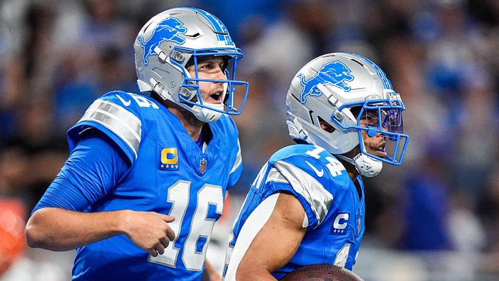 Detroit Lions wide receiver Amon-Ra St. Brown (14) celebrates a touchdown against Cleveland Browns with quarterback Jared Goff (16) during the second half at Ford Field in Detroit on Sunday, Sept. 28, 2025.