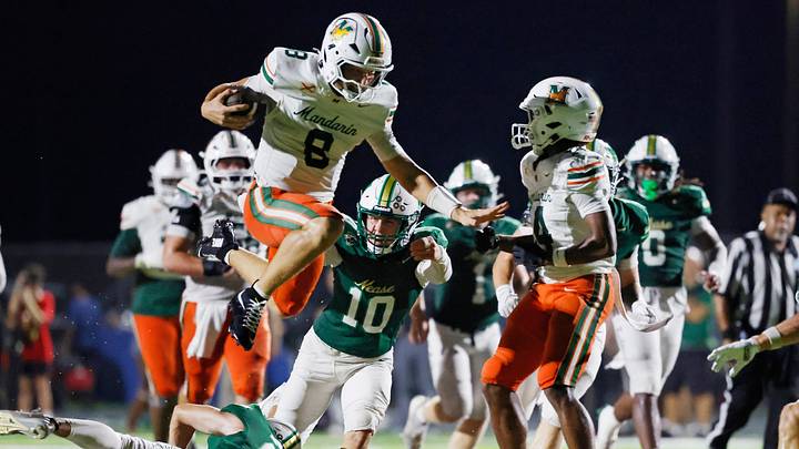Mandarin quarterback Knox Annis (8) hurdles Nease’s Austin Taylor (22) during the second quarter of their game on Sept. 11, 2026, in Ponte Vedra Beach. The Mustangs last week beat Ponte Vedra, 34-10, to run their record to 6-1. Mandarin quarterback Knox Annis (8) hurdles Nease’s Austin Taylor (22) during the second quarter of their game on Sept. 11, 2026, in Ponte Vedra Beach. The Mustangs last week beat Ponte Vedra, 34-10, to run their record to 6-1.