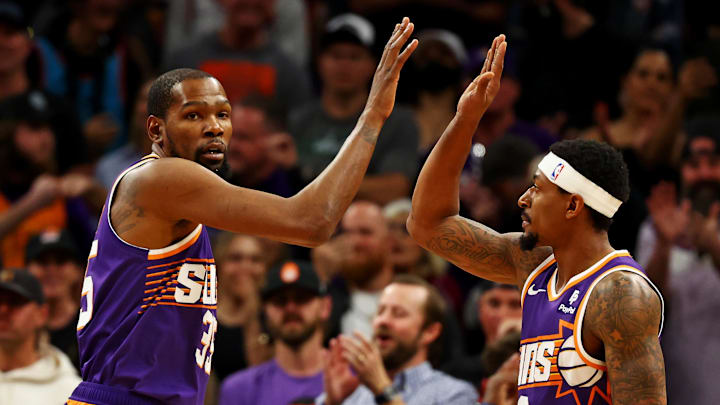 Phoenix Suns stars Kevin Durant and Bradley Beal celebrate a basket.