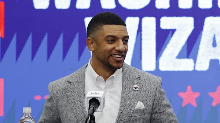 Jan 9, 2026; Washington, District of Columbia, USA; Washington Wizards general manager Will Dawkins (L) introduces newly acquired Wizards guard Trae Young (R) at a press conference prior to the Wizards' game against the New Orleans Pelicans at Capital One Arena. Mandatory Credit: Geoff Burke-Imagn Images