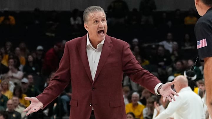 Arkansas Razorbacks head coach John Calipari argues with an official during a break in play against the Baylor Bears during the first half at American Airlines Center.