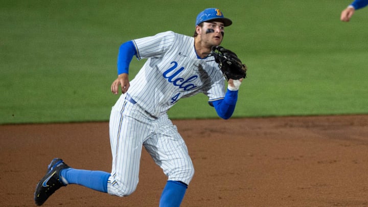 UCLA Bruins infielder Kyle Karros (44) grabs a bouncing ground ball as Auburn Tigers take on UCLA Bruins during the NCAA regional baseball tournament at Plainsman Park in Auburn, Ala., on Sunday, June 5, 2022.
