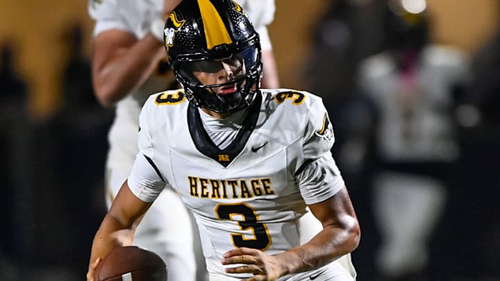 American Heritage star quarterback Dia Bell runs for yardage during a season opening win over St. Joseph Prep, on Aug. 22, 2025.
