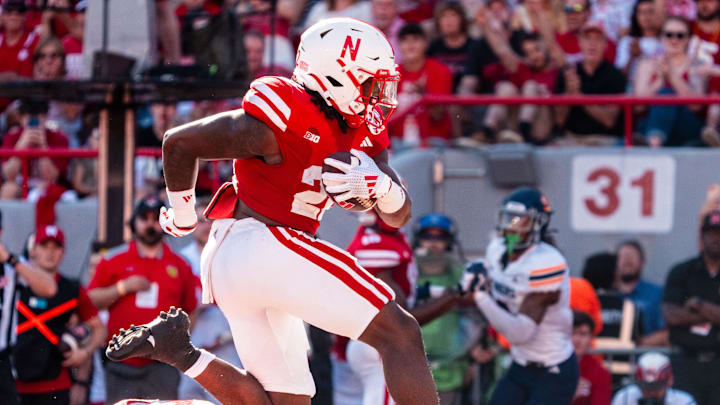 Aug 31, 2024; Lincoln, Nebraska, USA; Nebraska Cornhuskers running back Gabe Ervin Jr. (22) runs for a touchdown against the UTEP Miners during the third quarter at Memorial Stadium. Mandatory Credit: Dylan Widger-Imagn Images Aug 31, 2024; Lincoln, Nebraska, USA; Nebraska Cornhuskers running back Gabe Ervin Jr. (22) runs for a touchdown against the UTEP Miners during the third quarter at Memorial Stadium. Mandatory Credit: Dylan Widger-Imagn Images