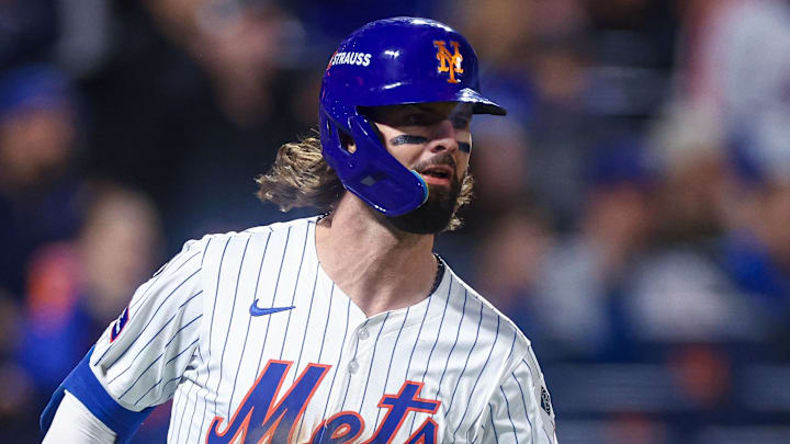 Oct 18, 2024; New York City, New York, USA; New York Mets left fielder Jesse Winker (3) singles during game five of the NLCS for the 2024 MLB playoffs against the Los Angeles Dodgers at Citi Field. Mandatory Credit: Vincent Carchietta-Imagn Images