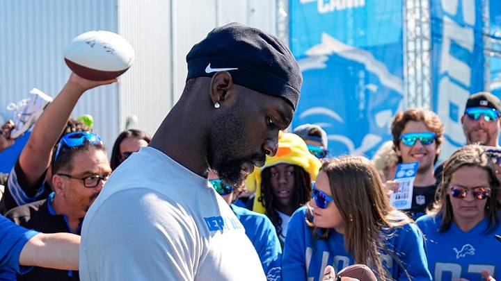 Detroit Lions safety Kerby Joseph signs autographs for fans after practice during training camp Detroit Lions safety Kerby Joseph signs autographs for fans after practice during training camp