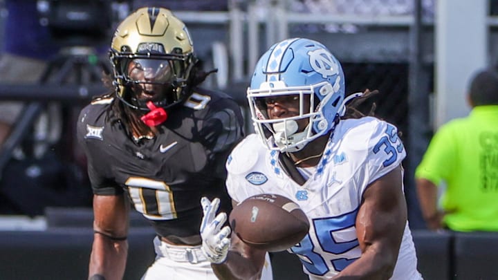 Sep 20, 2025; Orlando, Florida, USA; Carolina Tar Heels running back Demon June (35) catches a pass during the second quarter against the UCF Knights at the Bounce House Stadium. Mandatory Credit: Mike Watters-Imagn Images