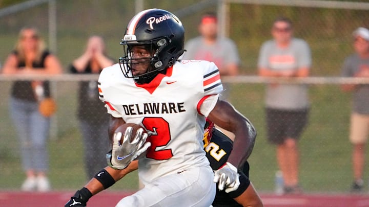 Sep 13, 2024; Sunbury, Ohio, USA; Delaware Hayes Favour Akih (2) runs the ball in for a touchdown against Big Walnut in the first half at Big Walnut High School.
