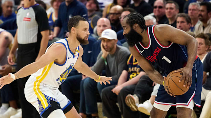 Apr 13, 2025; San Francisco, California, USA; Golden State Warriors guard Stephen Curry (30) defends against LA Clippers guard James Harden (1) as referee Jacyn Goble (68) watches the play during the second quarter at Chase Center. Mandatory Credit: Robert Edwards-Imagn Images Apr 13, 2025; San Francisco, California, USA; Golden State Warriors guard Stephen Curry (30) defends against LA Clippers guard James Harden (1) as referee Jacyn Goble (68) watches the play during the second quarter at Chase Center. Mandatory Credit: Robert Edwards-Imagn Images