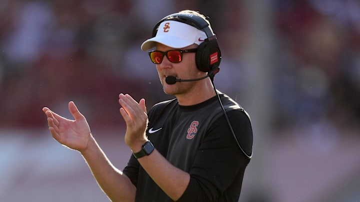 Aug 30, 2025; Los Angeles, California, USA; Southern California Trojans head coach Lincoln Riley watches from the sidelines against the Missouri State Bears in the first half at United Airlines Field at Los Angeles Memorial Coliseum. Mandatory Credit: Kirby Lee-Imagn Images