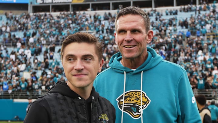 Jan 4, 2026; Jacksonville, Florida, USA; Jacksonville Jaguars general manager James Gladstone (left) and executive vice president of football operations Tony Boselli stand on the field after the game against the Tennessee Titans at EverBank Stadium. 