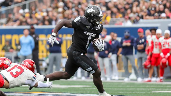 Oct 10, 2026; Morgantown, West Virginia, USA; West Virginia Mountaineers running back Amari Latimer (1) runs the ball during the first quarter against the Arizona Wildcats at Milan Puskar Stadium. Mandatory Credit: Ben Queen-Imagn Images Oct 10, 2026; Morgantown, West Virginia, USA; West Virginia Mountaineers running back Amari Latimer (1) runs the ball during the first quarter against the Arizona Wildcats at Milan Puskar Stadium. Mandatory Credit: Ben Queen-Imagn Images