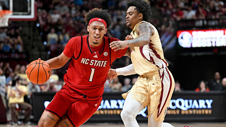 Jan 10, 2026; Tallahassee, Florida, USA; North Carolina State Wolfpack forward Darrion Williams (1) drives to the net past Florida State Seminoles guard Martin Somerville (1) during the first half at Donald L. Tucker Center. Mandatory Credit: Melina Myers-Imagn Images Jan 10, 2026; Tallahassee, Florida, USA; North Carolina State Wolfpack forward Darrion Williams (1) drives to the net past Florida State Seminoles guard Martin Somerville (1) during the first half at Donald L. Tucker Center. Mandatory Credit: Melina Myers-Imagn Images
