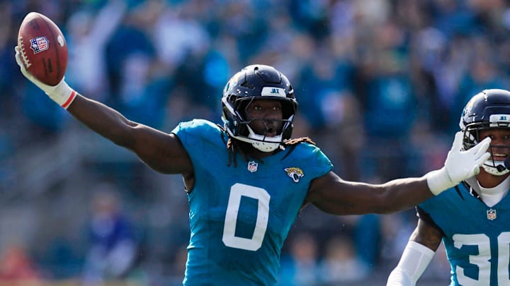 Jacksonville Jaguars linebacker Devin Lloyd (0) reacts to a fumble recovery next to cornerback Montaric Brown (30) during the second quarter of an NFL football AFC Wild Card playoff matchup, Sunday, Jan. 11, 2026, in Jacksonville, Fla. The Bills defeated the Jaguars 27-24. [Corey Perrine/Florida Times-Union]