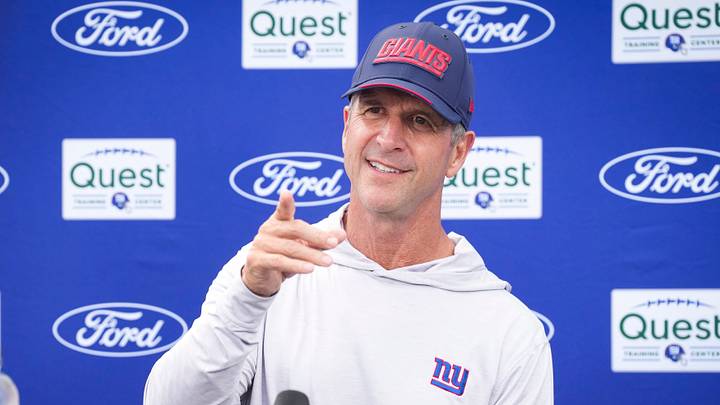 New York Giants head coach John Harbaugh points while speaking to members of the media after training camp New York Giants head coach John Harbaugh points while speaking to members of the media after training camp