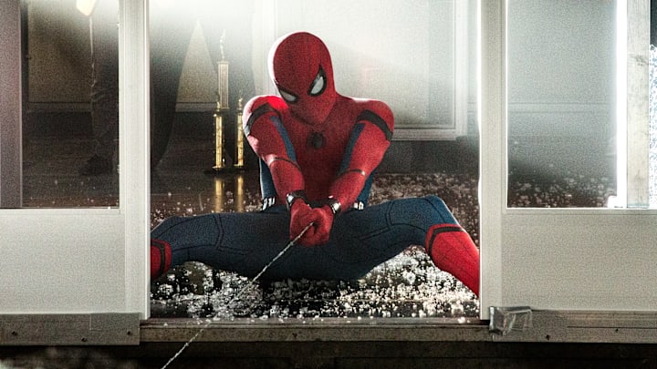 Spider-Man works to stop the elevator from falling in Columbia Pictures' SPIDER-MAN™: HOMECOMING.