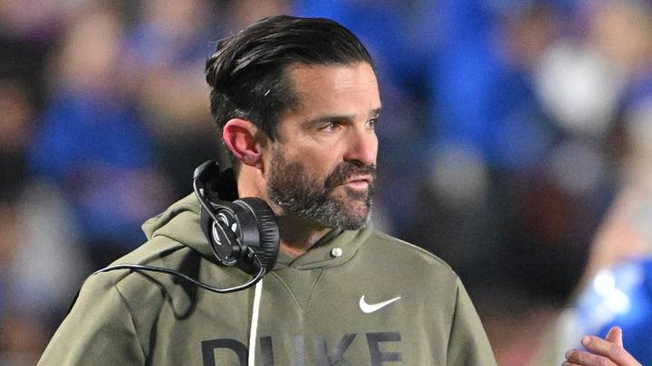 Nov 15, 2025; Durham, North Carolina, USA; Duke Blue Devils head coach Manny Diaz reacts during the third quarter against the Virginia Cavaliers at Wallace Wade Stadium. Mandatory Credit: Zachary Taft-Imagn Images Nov 15, 2025; Durham, North Carolina, USA; Duke Blue Devils head coach Manny Diaz reacts during the third quarter against the Virginia Cavaliers at Wallace Wade Stadium. Mandatory Credit: Zachary Taft-Imagn Images